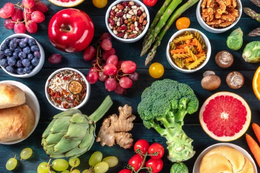 Consultation notes beside a bowl of fresh produce
